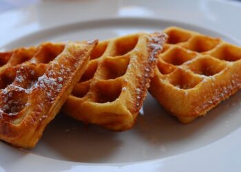 three waffles on a white plate