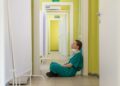 nurse sitting on the ground in the hospital