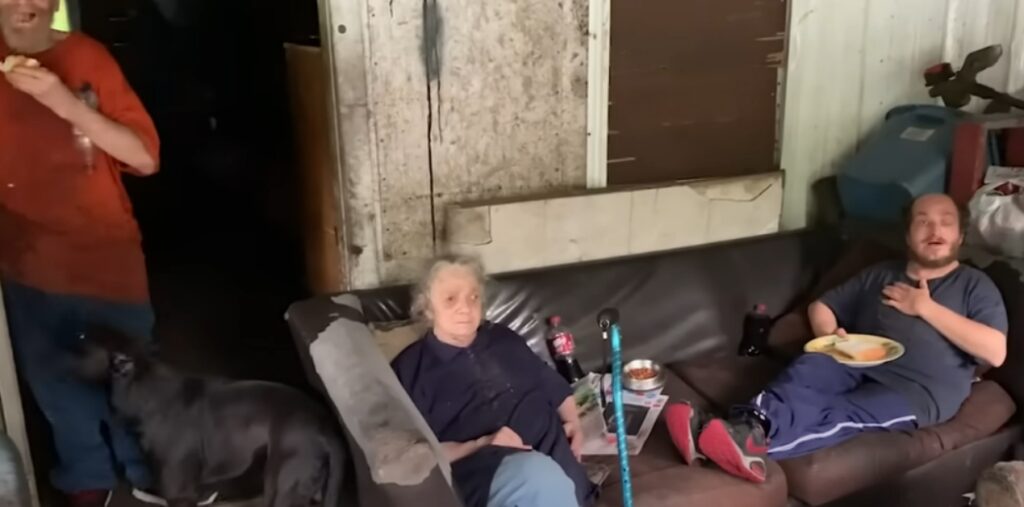 The Whittakers sitting outside their home