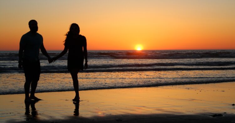 Couple at the beach (Photo by Nickay3111 via Flickr)