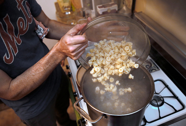 Pasta goes into a pot of salted boiling water at the home of Josh Even of Tosca in San Francisco, Calif., on Monday, May 23, 2016.
