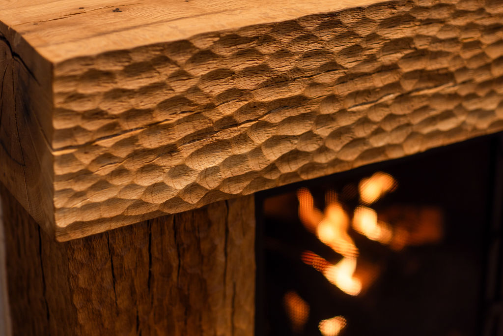 Vince Skelly, a woodworker who takes single blocks of wood and turns them into benches, chairs, stools, tables and sculptures that straddle functional and decorative purposes at his home