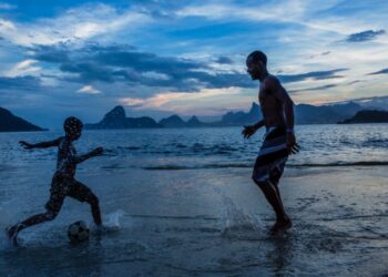 Parent and Child play football (Photo by Christopher Pillitz Getty Images)