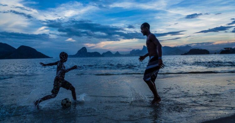 Parent and Child play football (Photo by Christopher Pillitz Getty Images)
