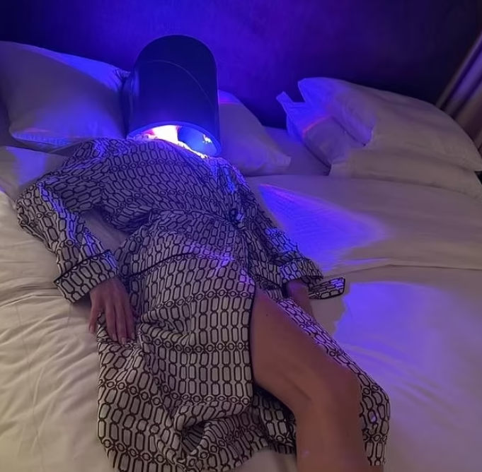 Victoria Beckham with her Dermalux LED device