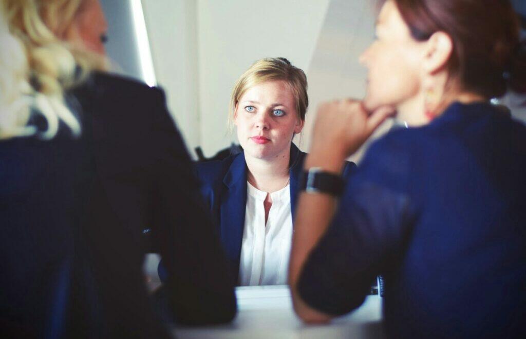 Woman on job interview (Unsplash | Tim Gouw)