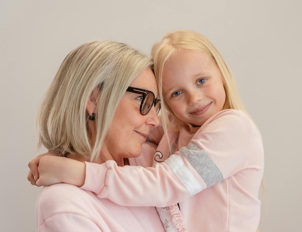 Grandma hugging young girl