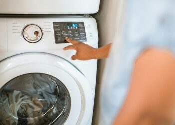 person using washing machine