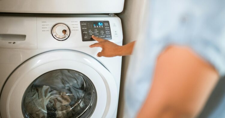 person using washing machine