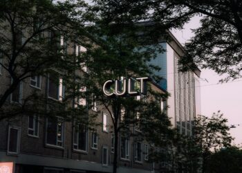 a building with a sign that says cut above it