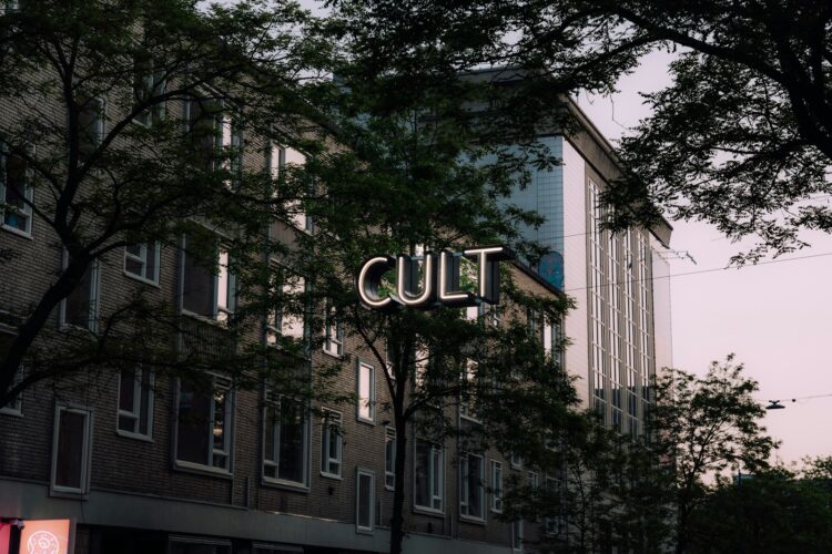 a building with a sign that says cut above it