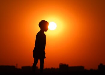 Boy in sunset (Photo by Silas Stein/picture alliance via Getty Images)