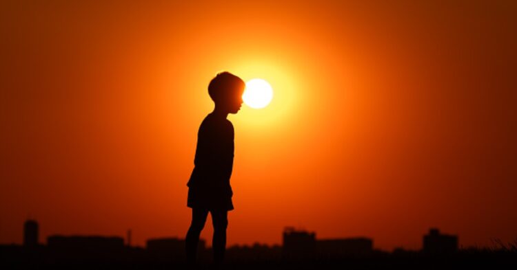 Boy in sunset (Photo by Silas Stein/picture alliance via Getty Images)