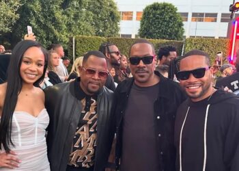 Jasmine Lawrence, Martin Lawrence, Eddie Murphy, and Eric Murphy on a red carpet