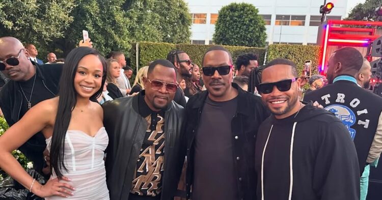 Jasmine Lawrence, Martin Lawrence, Eddie Murphy, and Eric Murphy on a red carpet