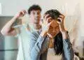 An upset couple arguing in a kitchen, highlighting stress and frustration in relationships.