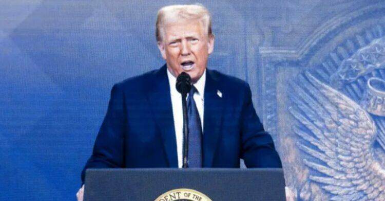 Donald Trump speaking at podium (EPA)