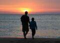 Father and daughter by the sea at sunset (Unsplash | Emotionary App)