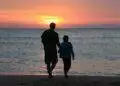 Father and daughter by the sea at sunset (Unsplash | Emotionary App)