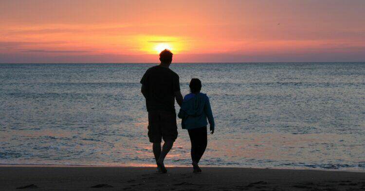 Father and daughter by the sea at sunset (Unsplash | Emotionary App)