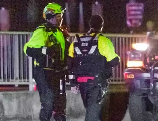 Divers at the scene of the crash of the American Airlines flight 5342