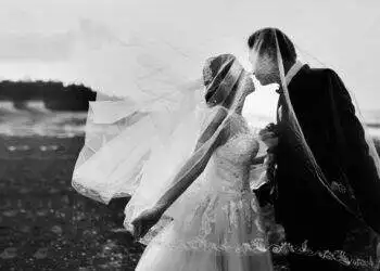 grayscale shot of bride and groom
