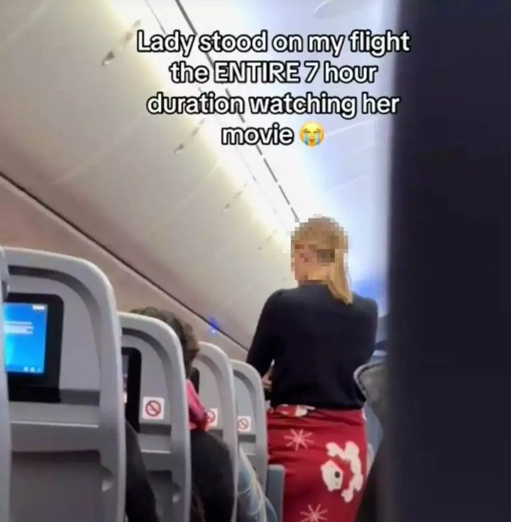Woman standing during flight