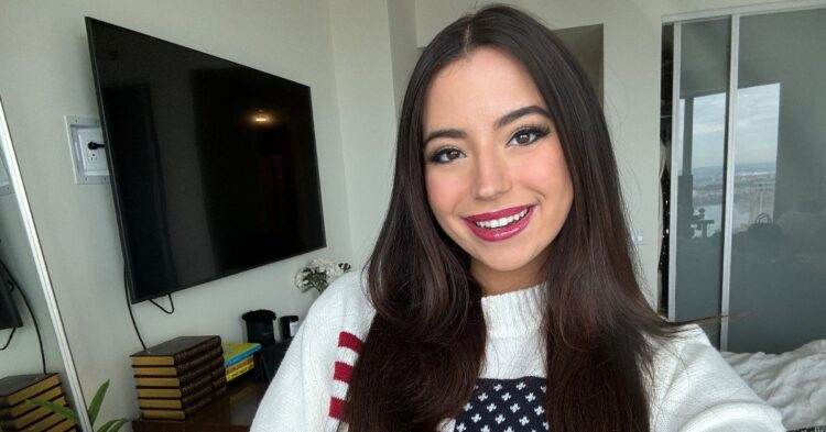 Ashley St. Claire selfie wearing American Flag sweatshirt (X | stclairashley)
