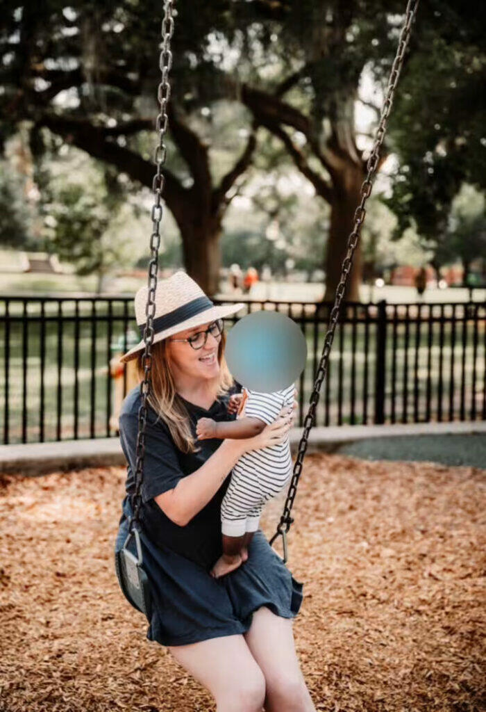 Krystena Murray with child in park (Peiffer Wolf Carr Kane Conway & Wise)