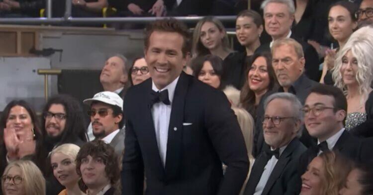Ryan Reynolds laughing in SNL 50th anniversary crowd (YouTube | SNL)