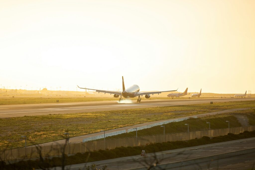 gray airplane at runway