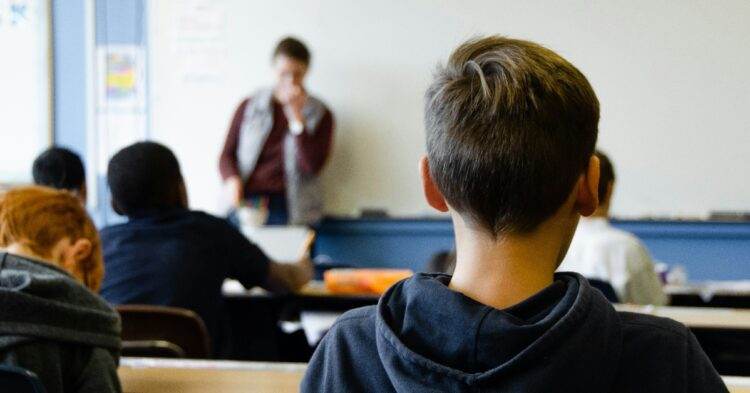 Children in class with focus on one boy