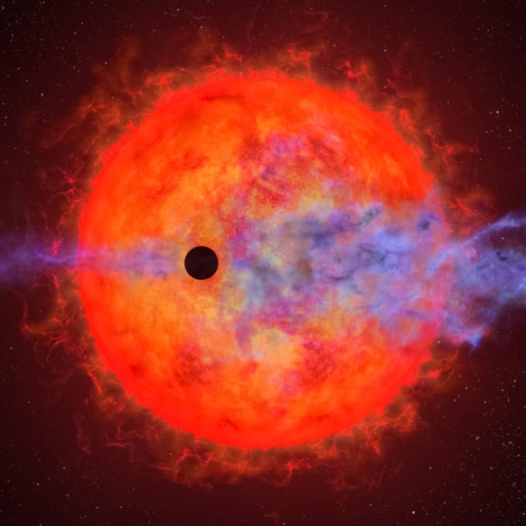 a black hole in the center of a red and blue star