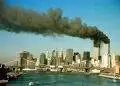 The towers of the World Trade Center pour smoke shortly after being struck by hijacked commercial aircraft, September 11