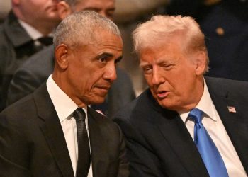 Former President Barack Obama speaks with President-elect Donald Trump before the State Funeral Service for former President Jimmy Carter at the Washington National Cathedral in Washington, Jan. 9, 2025.