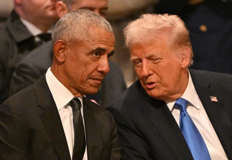 Former President Barack Obama speaks with President-elect Donald Trump before the State Funeral Service for former President Jimmy Carter at the Washington National Cathedral in Washington, Jan. 9, 2025.