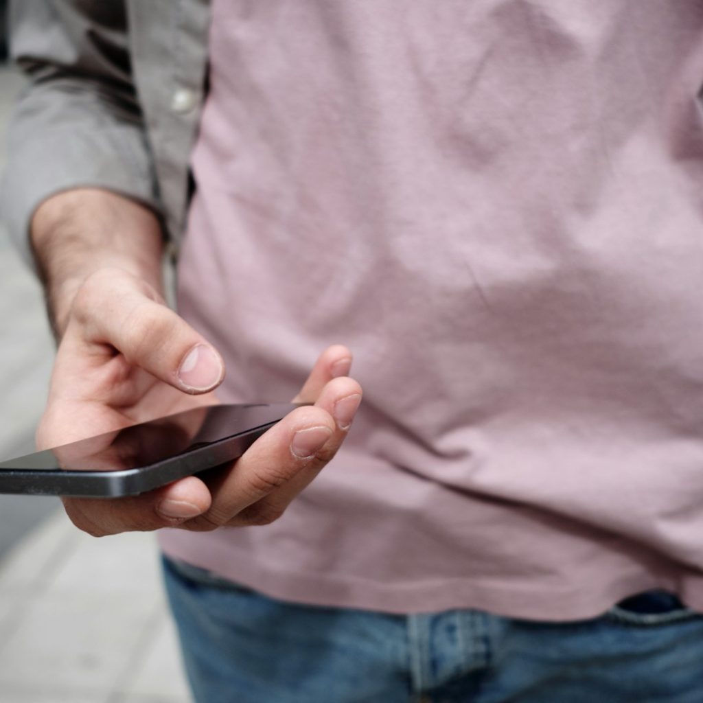 person holding phone while holding