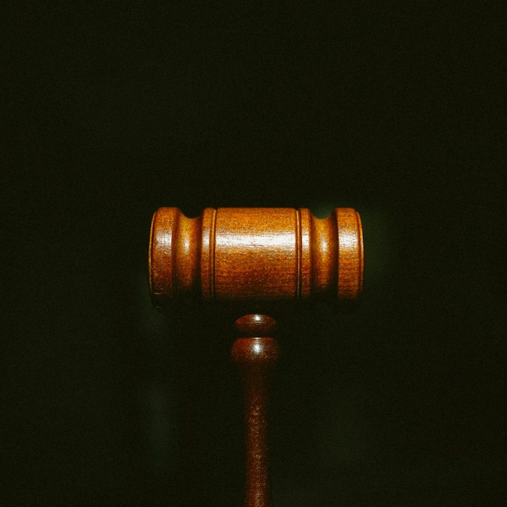 brown wooden stand with black background