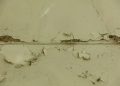 a close up of a wall with peeling paint