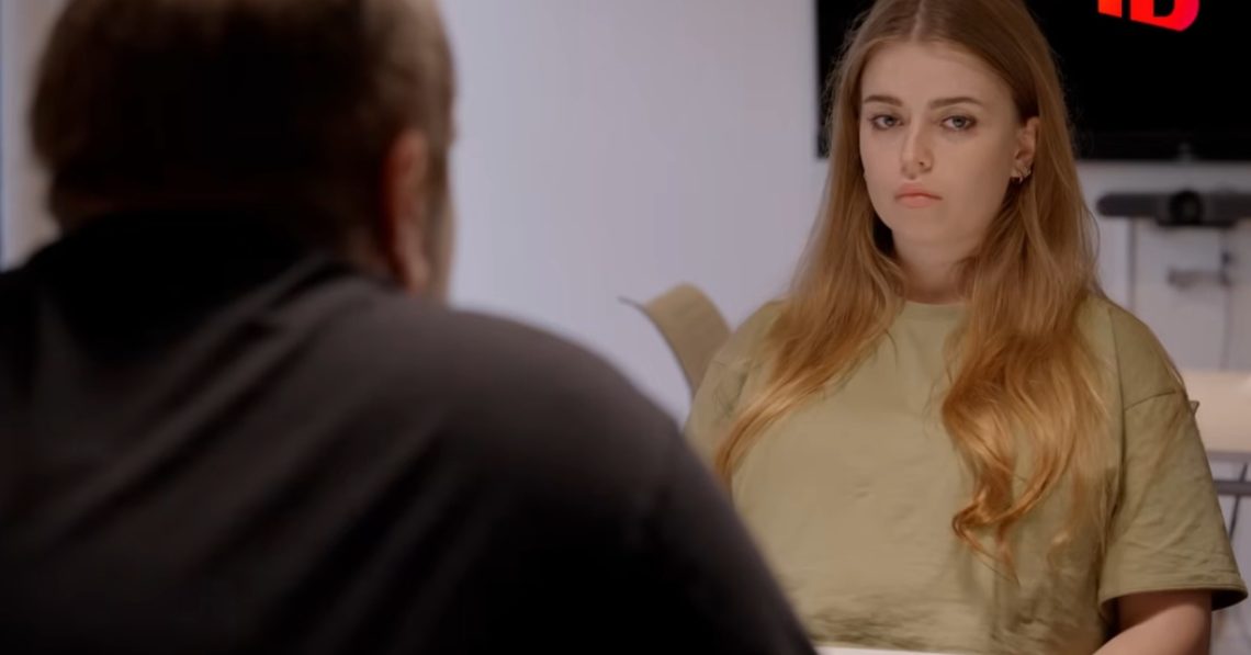 Jamie-Lee Arrow sitting in front of her cannibal father Drabbad