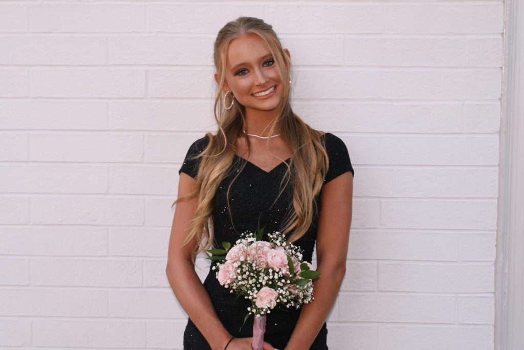 Anna Grace Phelan holding flowers