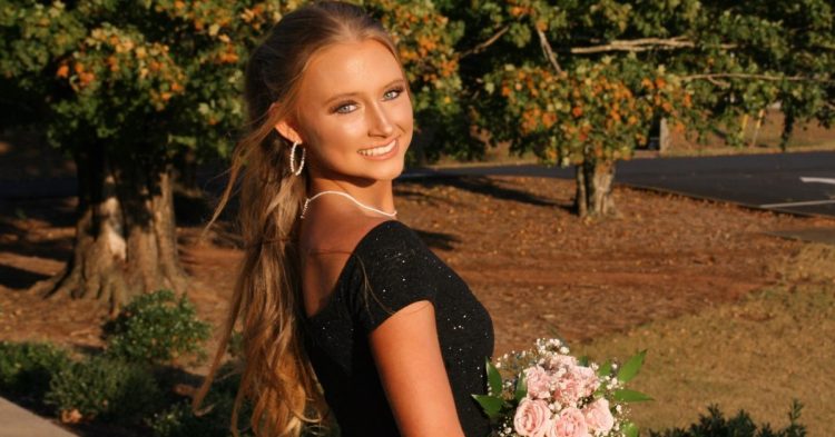 Anna Grace Phelan holding flowers
