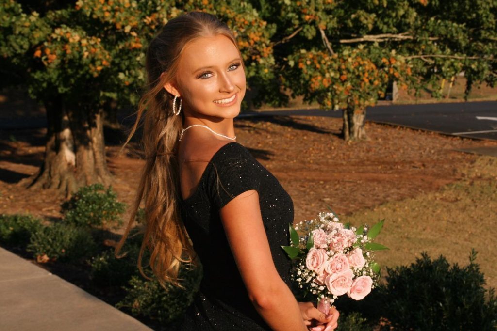 Anna Grace Phelan holding flowers