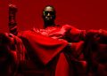 sean 'combs' diddy wearing red and sitting on a chair