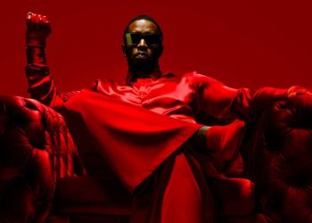 sean 'combs' diddy wearing red and sitting on a chair