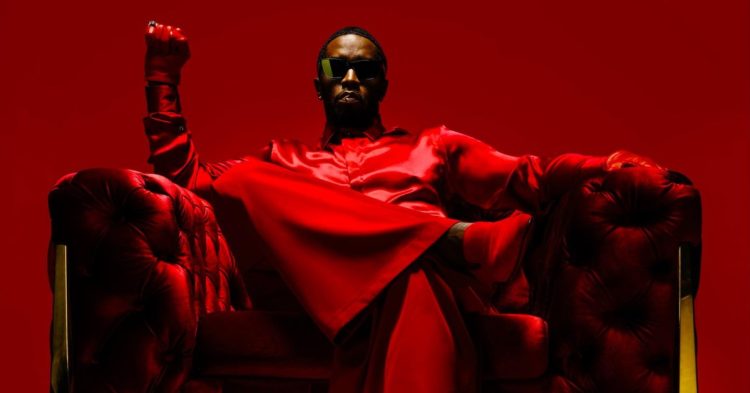 sean 'combs' diddy wearing red and sitting on a chair