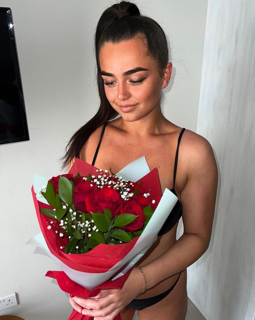 Georgia O’Connor holding flowers