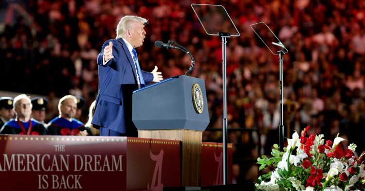 Trump at rally standing at mic