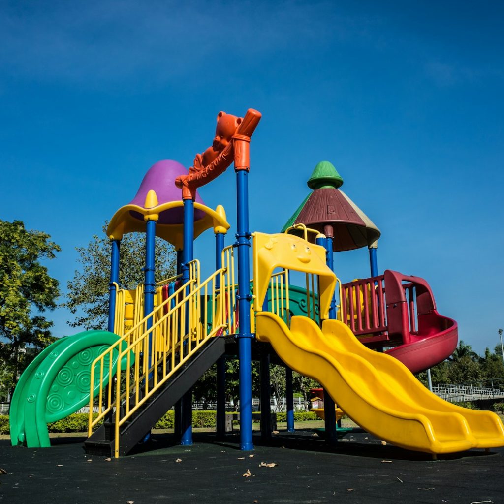 multicolored playground slide during daytime