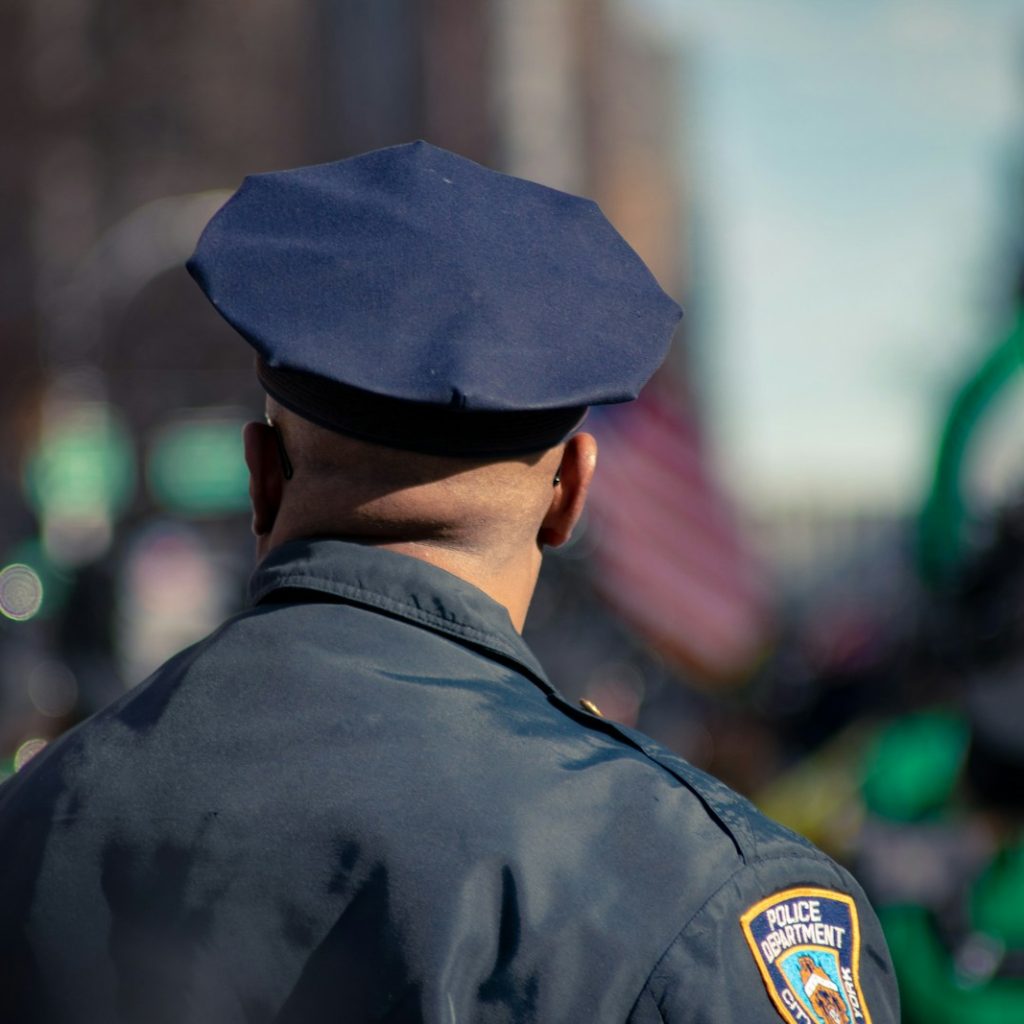 man wearing police uniform selective focus photo